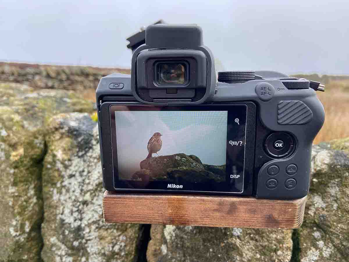 The camera setup on a stone wall and bean bag