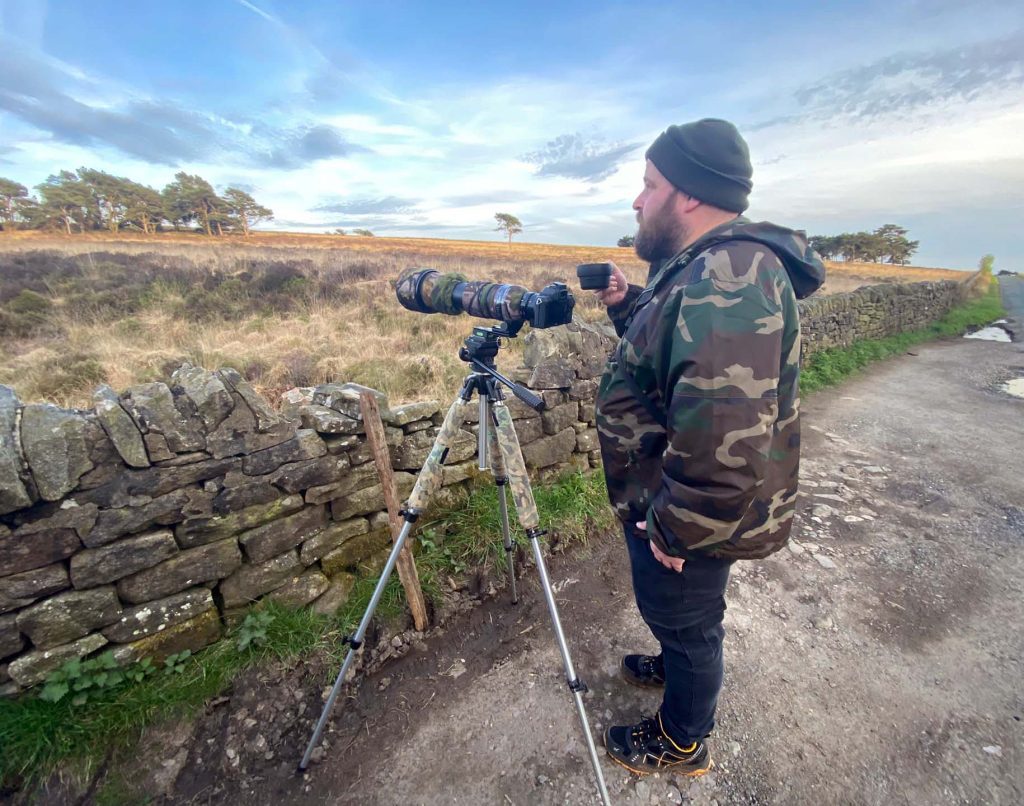 Scott watching Cuckoos with a cup of tea